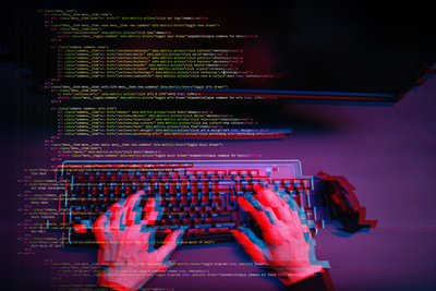 A hacker working with a computer