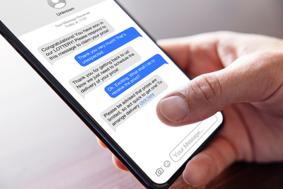Example image of a phone text conversation with a scammer trying to steal someones personal details