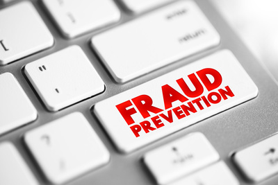 text concept button on a computer keyboard with the word fraud prevention