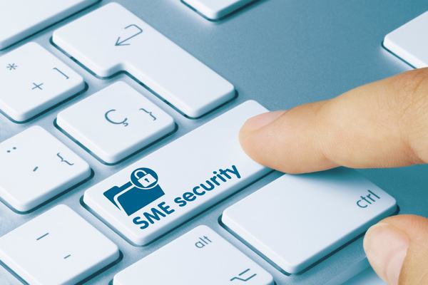 an image of a computer keyboard with a finger hovering over an SME Security button in place of the shift key